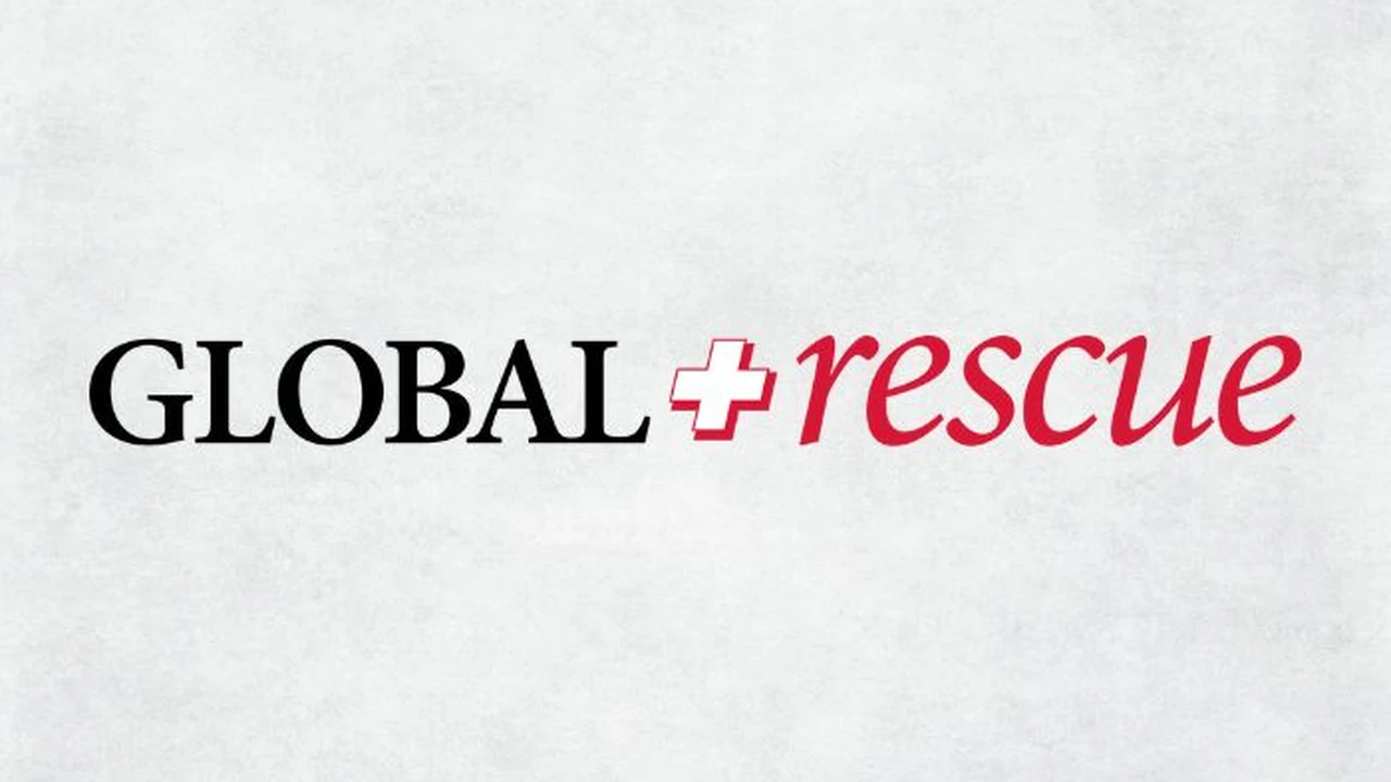 Two mint chocolate milkshakes with whipped cream and green sprinkles.