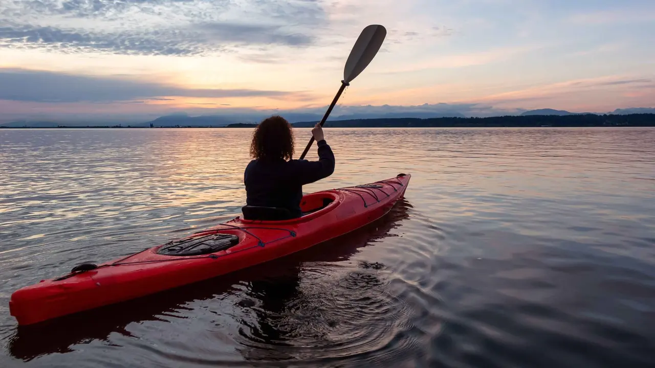 overhead view of corned beef sliced and on a platter with cabbage, potatoes, and carrots