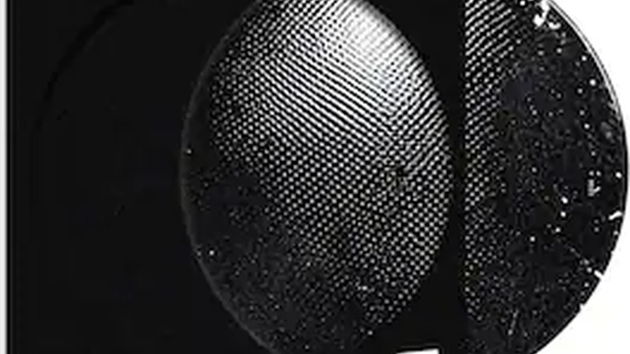 Two mint chocolate milkshakes with whipped cream and green sprinkles.