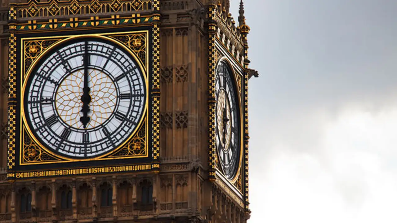 blue bowl of black bean beef tortilla soup on a board with cilantro and shredded cheese in background