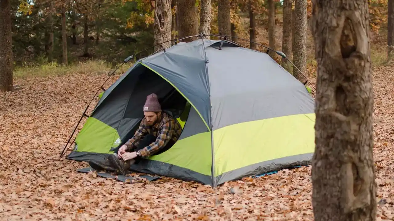 Close up on a plate of mashed potatoes, topped with baked pork chops with cream of mushroom soup, and a side of green beans.