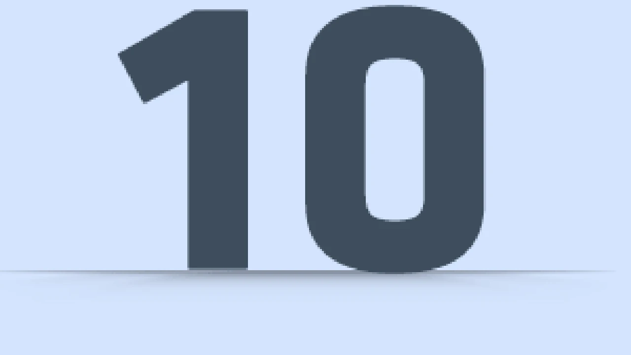 Close up on a plate of mashed potatoes, topped with baked pork chops with cream of mushroom soup, and a side of green beans.