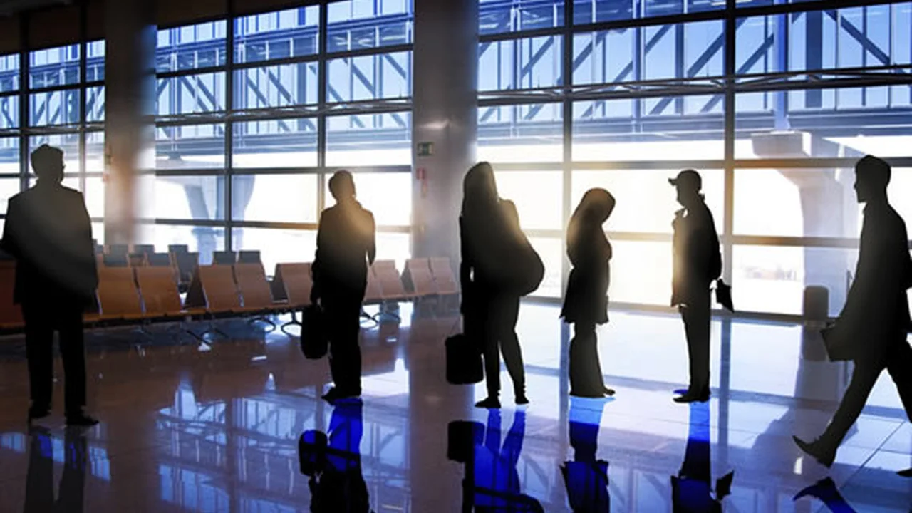 Close up on a plate of mashed potatoes, topped with baked pork chops with cream of mushroom soup, and a side of green beans.
