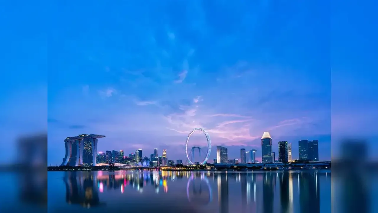 Close up on a plate of mashed potatoes, topped with baked pork chops with cream of mushroom soup, and a side of green beans.